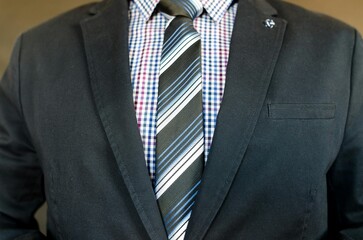 businessman adjusting tie