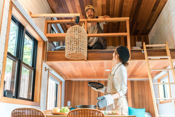 Mother, mom, housewife preparing meals on family trip, cottage, bungalow
