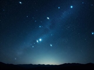 Fototapeta premium Stunning starry night sky over mountain range at dusk