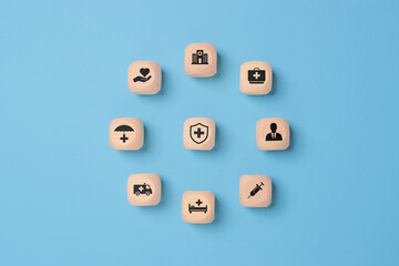 Health insurance and medical care concept. A set of wooden blocks displaying health-related icons, medical care, health insurance, and medication. healthcare services, protection, insurance coverage
