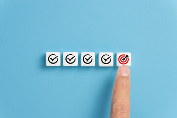 Checklist, Mission plan, Task list, Survey review, Quality control, Goals achievement, and Business success. To-do list for achieving targets. Hand point on target dartboard icons on dice.