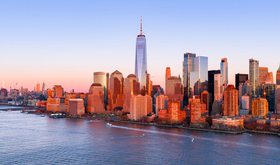 Obraz premium New York City panoramic skyline with skyscrapers at dusk. NYC panoramic night skyline with Manhattan. New York panoramic cityscape at dusk. New York City aerial panoramic view of Manhattan.