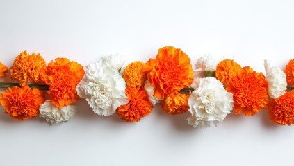 Vibrant photo of Festive garland of orange and white marigold flowers isolated on white background