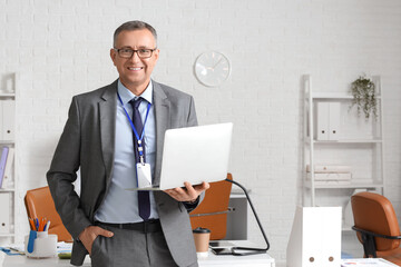 Male business analyst with laptop in office. Data science concept