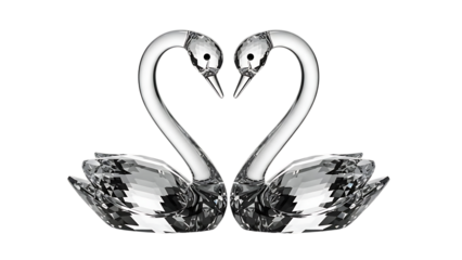 A pair of crystal swans forming a heart shape on black background
