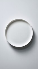 Vibrant photo of Top view of an empty white ceramic plate isolated on white background