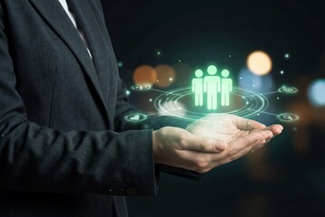 Businesswoman holding digital human resources hologram with team icon and network connections