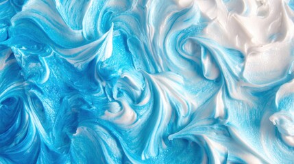 Fototapeta premium Swirls of blue and white cream on a smooth surface in bright light