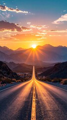 Straight asphalt road leading to a brilliant sunset over mountains