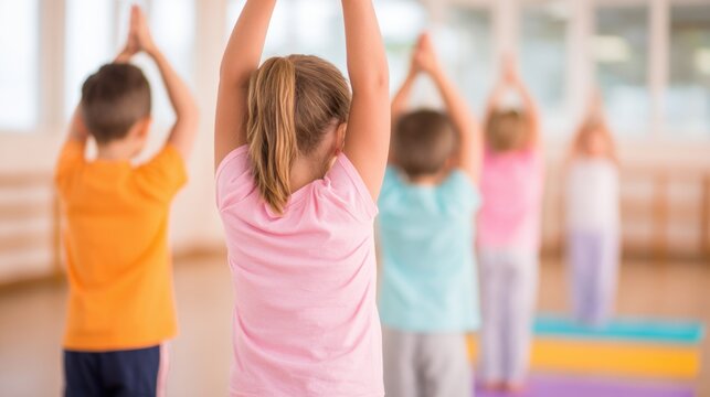 Children practice yoga in a studio during an afternoon class