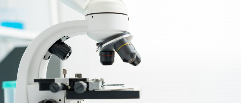 Scientist analyze biochemical samples in advanced scientific laboratory. Medical professional use microscope look microbiological developmental of viral. Biotechnology research in science lab.