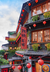 Fototapeta premium Jiufen Old Street is a narrow, winding alleyway with shops, teahouses, and restaurants that offers tourists a view of traditional Taiwanese life.