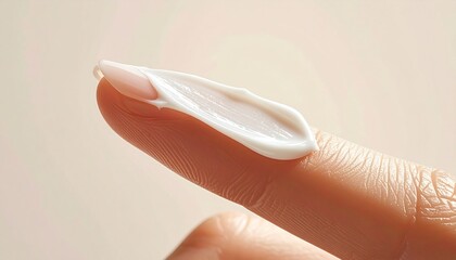 A woman provides gentle skincare treatment to a ballet dancer by applying moisturizing cream to her tired leg and feet during a close up beauty and hygiene routine