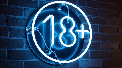 A vibrant blue neon sign displaying the 18 age restriction symbol glows brightly against a dark textured brick wall indicating a venue or content suitable only for adults creating an atmosphere of ex.