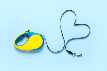Retractable dog leash on blue background