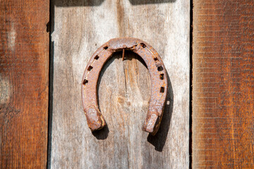 Old Rusty Horseshoe on Wood