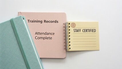 Training Records and Certification Notebook on a White Background for Administrative Use in Professional Environment