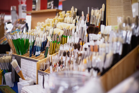 Multiple artist's paint brushes on display for sale in an artist supply store - horizontal
