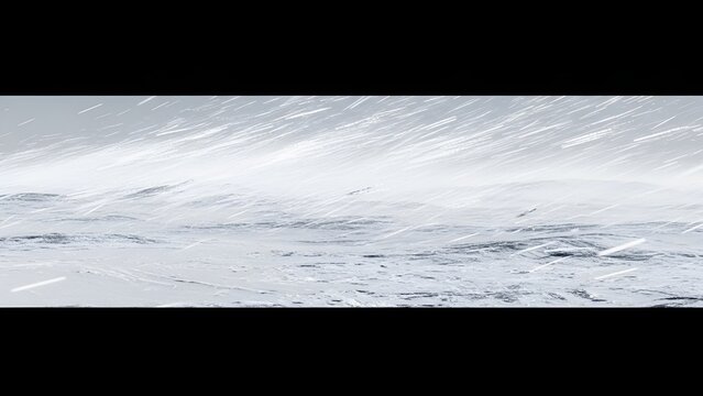 A blizzard sweeping across a frozen landscape, the stark beauty of a winterstorm