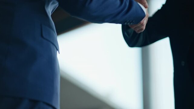 Businessman handshake for teamwork of business merger and acquisition,successful negotiate,hand shake,two businessman shake hand with partner to celebration partnership and business deal concept
