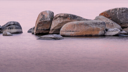 Lake Tahoe boulders in the water at sunrise © Aaron