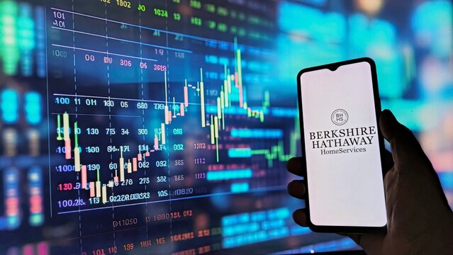 Berkshire Hathaway HomeServices app on smartphone with stock market data