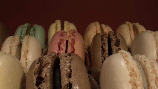 Macarons in mood, Spectacular display of macarons with emphasized textures and fillings in subtle lighting