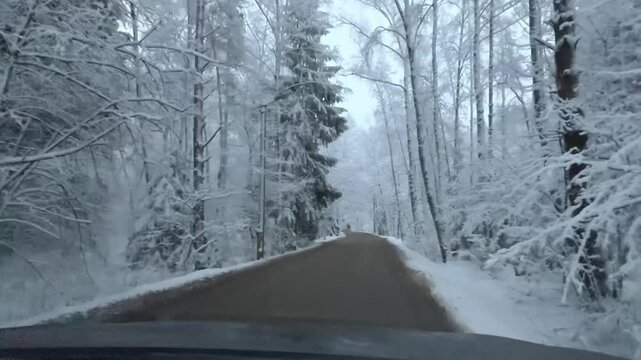 A snow-covered road in Odintsovo, Russia. A stunning landscape of cars on a winter road. The beauty of the scenery is breathtaking