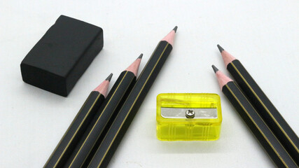Black wooden pencil with sharpener on white background