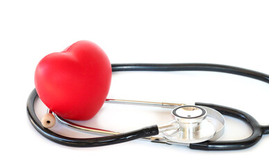 Stethoscope arranged as heart with red accent, doctor and health care theme.