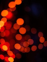 Dreamy, glowing orbs of light against a dark, blurred backdrop, perfect for festive or atmospheric visuals,  lights,  soft