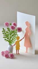 A whimsical paper art scene featuring a child holding hands with a woman beside a vase of pink flowers, evoking themes of love and connection.