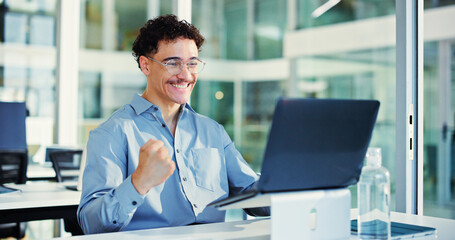 Celebration, fist pump and man with laptop in office for funding opportunity, good news and excited. Smile, email and person happy for business growth with investment, success or bonus achievement