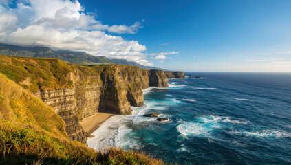 Fototapeta premium Cliff coastline ocean beach sea stack blue sky dramatic sunlight