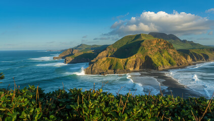 Lush coastal headland with dramatic cliffs and waves under blue sky