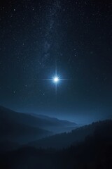 Shining star over mountain range