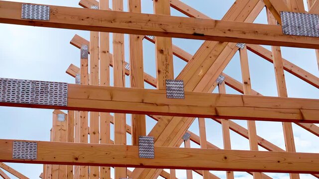 Timber roof truss system during construction prefabricated engineered framework triangular shape