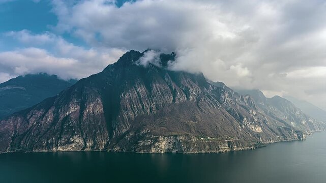 Corna Trentapassi prominent mountain overlooking Lake Iseo in Lombardy, Italy timelapse