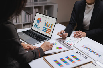 Business colleagues analyzing reports discussing financial data