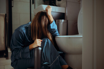 Woman with a Bottle of Wine Feels Unwell in the Bathroom. Person suffers side effects of alcohol excessive consumption such as a hangover
