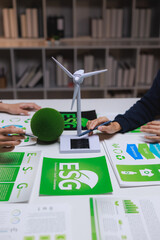 People discussing esg strategy with renewable energy models
