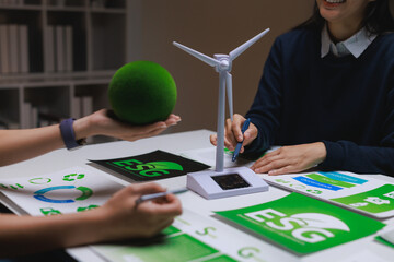 Business meeting discussing esg and green energy investment