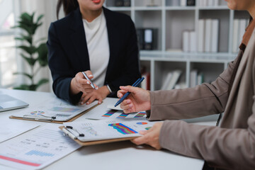 Businesswomen analyzing financial data during an office meeting