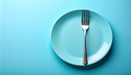 Single fork centered vertically on light blue plate against matching light blue background in minimalist setup.