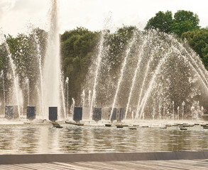 A beautiful large fountain in a park. Nature.