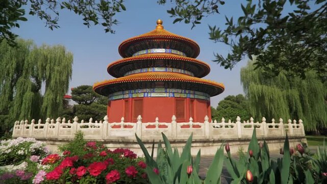 Chinese pagoda in a garden surrounded by flowers and trees