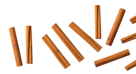 Multiple dried cinnamon sticks, earthy brown, elegantly scattered on a transparent background with copy space and soft bokeh, concept for food branding and culinary promotion
