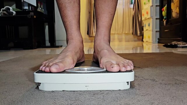 This is a man that doing morning routine weight monitor