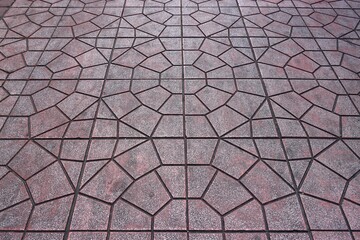 Old red stone tiles sidewalk texture background