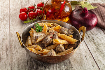 Fototapeta premium Italian pasta penne with chicken liver